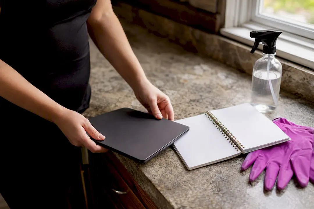 Cleaning checklist tablet and tools on table