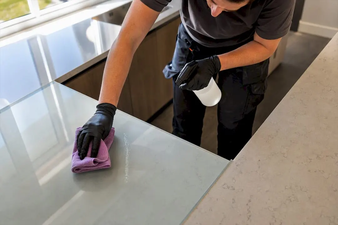 Cleaner removing sealant residue from glass